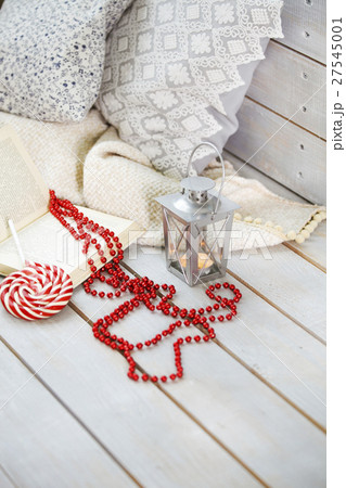 Christmas still life with lantern and red beads Christmas still life with lantern and red beads 27545001