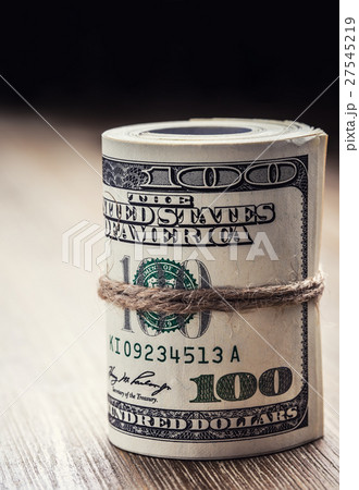Dollar banknotes rolled in other positions. 27545219
