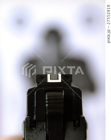 Aiming gun at target 27552919