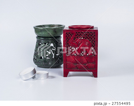 Red aroma lamp with candles on white background 27554495
