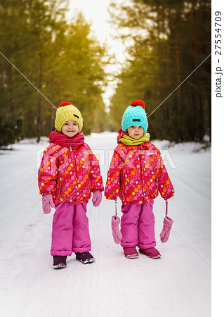 two girls in the winter in the forest two girls in the winter in the forest 27554709