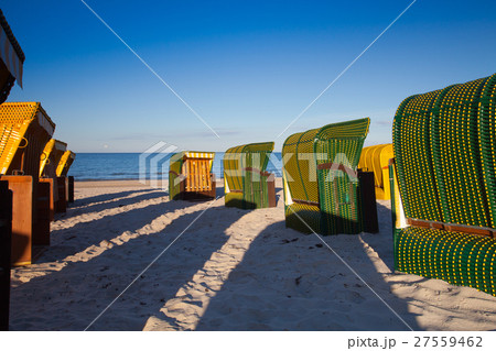 Traditional wooden beach chairs on Rugen island Traditional wooden beach chairs on Rugen island 27559462