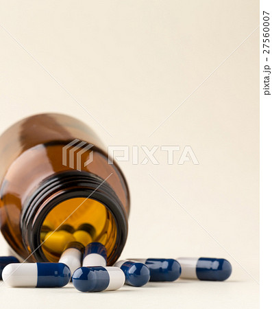 Bottle of pills from the brown glass and colorful 27560007