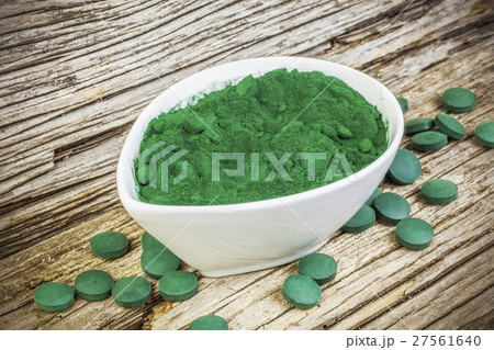 Spirulina,chlorella supplement powder and pills on 27561640