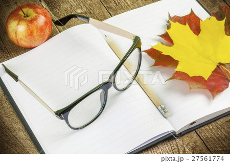 Glasses,notebook,pen and autumn leaves  27561774