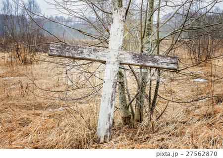 Old wooden cross in meadow  27562870