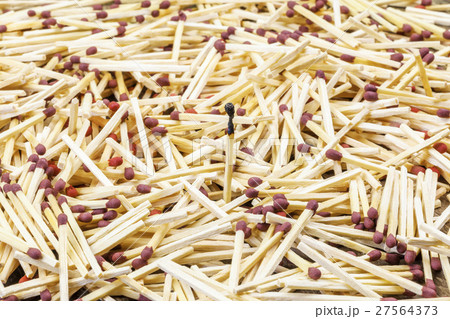 Parched one match in middle of matches heap Parched one match in middle of matches heap 27564373