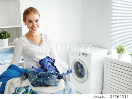 happy woman housewife in the laundry  27564552
