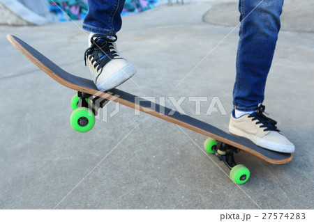 legs riding skateboard at skatepark 27574283