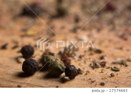 Close-up on a wooden board, ground pepper and peas Close-up on a wooden board, ground pepper and peas 27574665