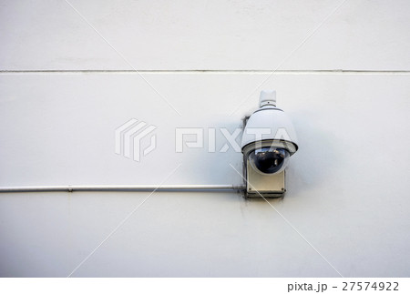 Security camera on concrete wall 27574922