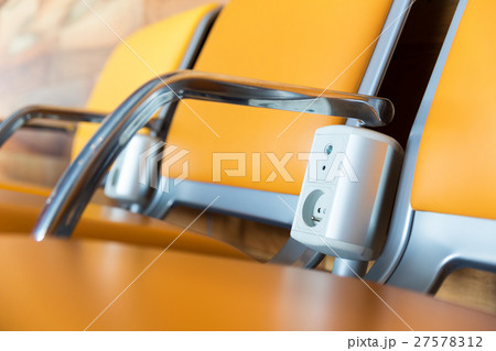 Chairs with electric outlet in airport. Chairs with electric outlet in airport. 27578312