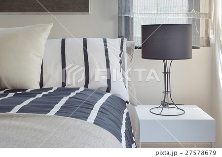Ready lamp with black shade lamp on bedside table 27578679