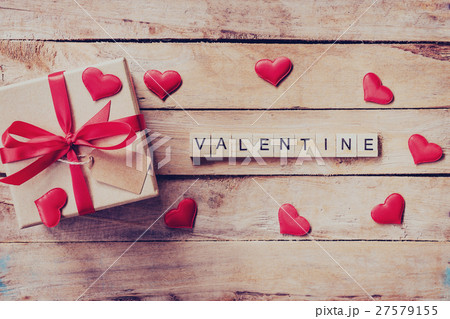 Gift box and red heart with wooden text Valentine 27579155