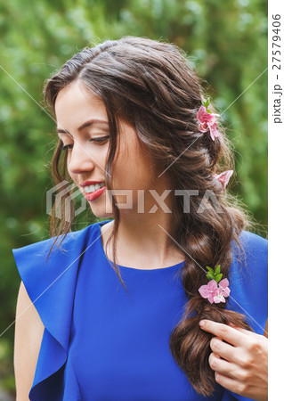 portrait of beautiful brunette with hairstyle for holiday 27579406