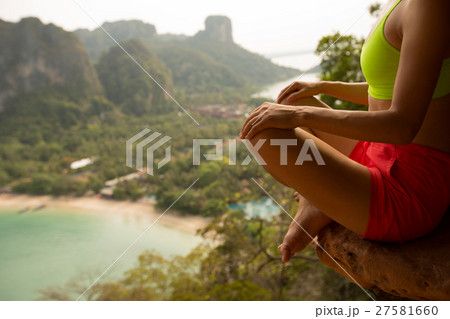 fitness woman practice yoga at mountain peak cliff fitness woman practice yoga at mountain peak cliff 27581660