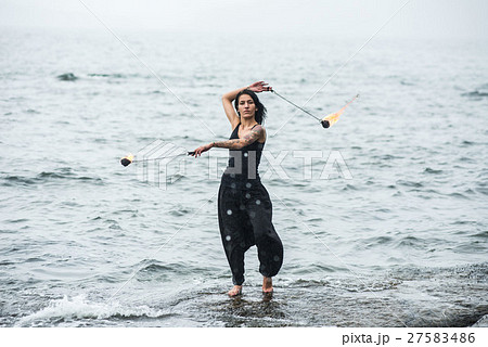 fire show on the shore of the sea 27583486