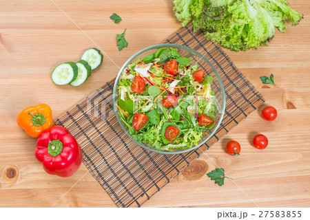 Salad of fresh vegetables and green on wooden  27583855