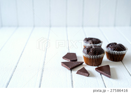 Chocolate muffins on a white rustic wooden table 27586416