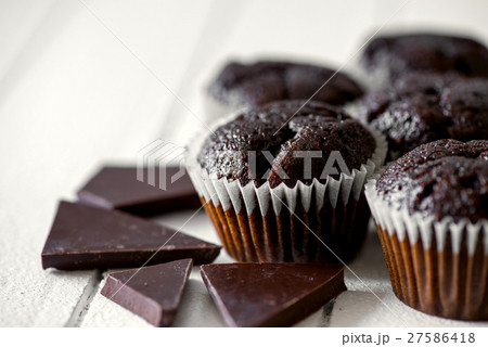 Chocolate muffins on a white rustic wooden table 27586418