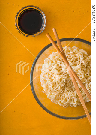Soup Ramen noodles in bowl and soy sause Soup Ramen noodles in bowl and soy sause 27588030