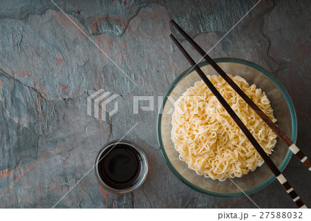 Soup Ramen noodles in glass bowl and wooden sticks Soup Ramen noodles in glass bowl and wooden sticks 27588032