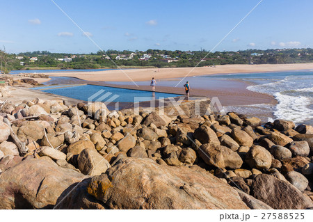 Women Exploring Beach Tidal Pool Landscape 27588525