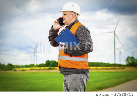 Electrician engineer talking on smart phone near W 27588715