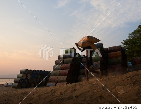 WORKER CARRYING SACKS ON SHOULDER WORKER CARRYING SACKS ON SHOULDER 27592465