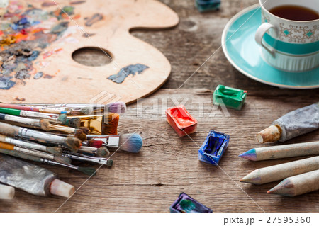 Paintbrushes, palette, pencils, coffee and paints Paintbrushes, palette, pencils, coffee and paints 27595360