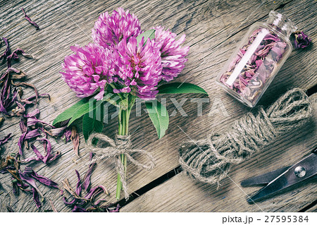 Clover, bottle with dried herb and jute rope 27595384