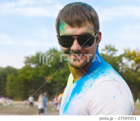Happy young man on holi color festival Happy young man on holi color festival 27595951