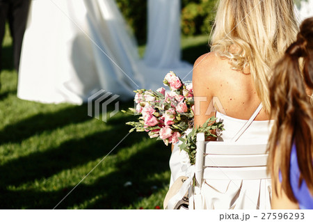 Look from behind at blonde lady Look from behind at blonde lady 27596293