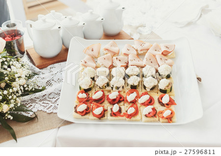 Tasty appetizers of fish and vegetables served Tasty appetizers of fish and vegetables served 27596811