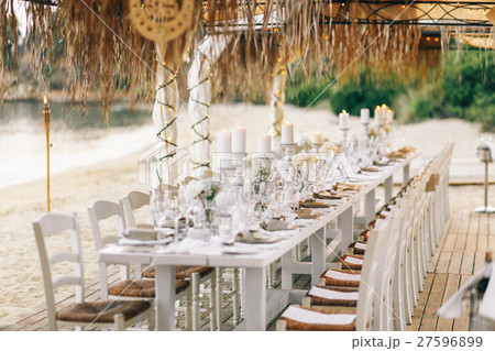 Long dinner table prepared for wedding party Long dinner table prepared for wedding party 27596899