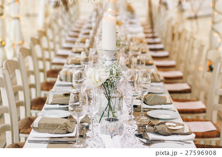 Sparkling glasswatr stands on dinner table Sparkling glasswatr stands on dinner table 27596908