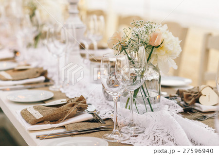 Wineglasses stand on dinner table with white  27596940