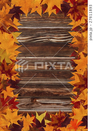 maple leaves and wooden background 27611893