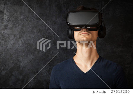 Man using VR goggles Man using VR goggles 27612230