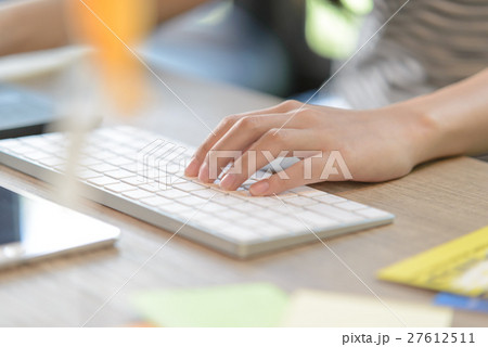 female left-hand typing on bluetooth keyboard 27612511