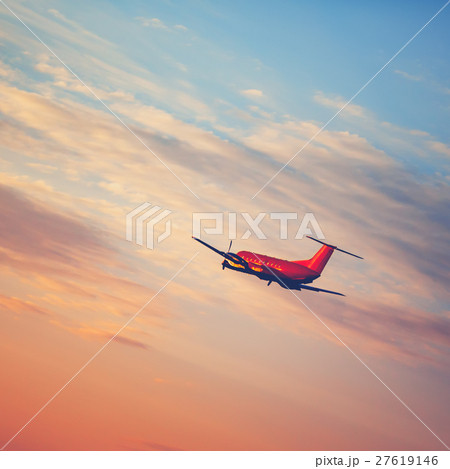 Airplane taking off at the sunset sky 27619146