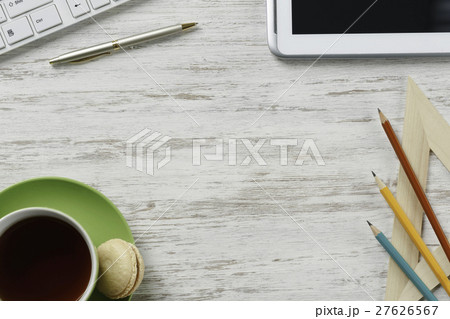 Office workplace with cup and macaroons 27626567