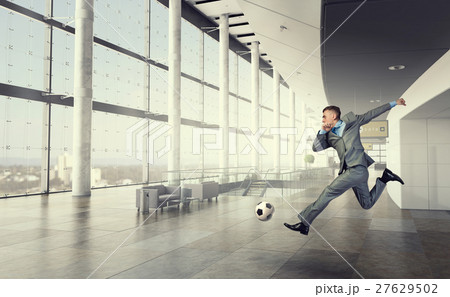 Playing football in office 27629502
