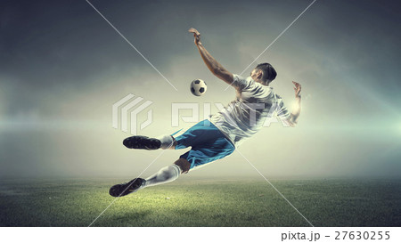 Soccer player kicking ball Soccer player kicking ball 27630255