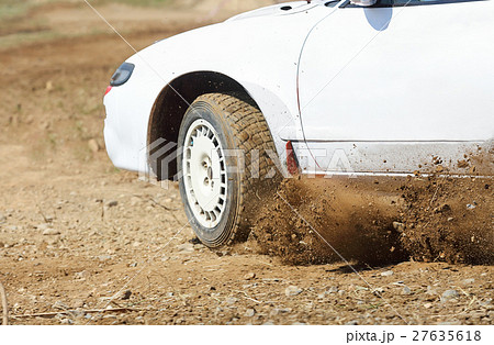 Rally car turning in track 27635618