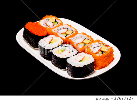 sushi in white plate on black background 27637327