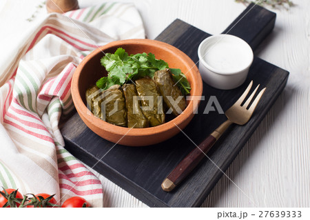 dolma with parsley and sour cream still life in a dolma with parsley and sour cream still life in a 27639333