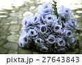 bouquet of blue rose lying on grey road 27643843