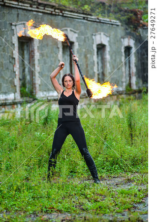Fire show girl with flaming torches Fire show girl with flaming torches 27649271