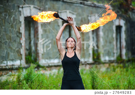 Fire show girl with flaming torches Fire show girl with flaming torches 27649283